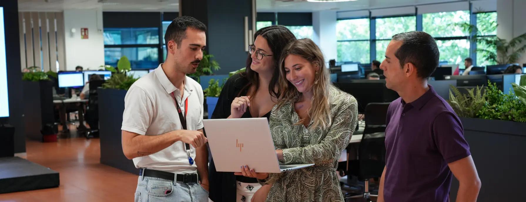 ELCA spain employees in front of a laptop