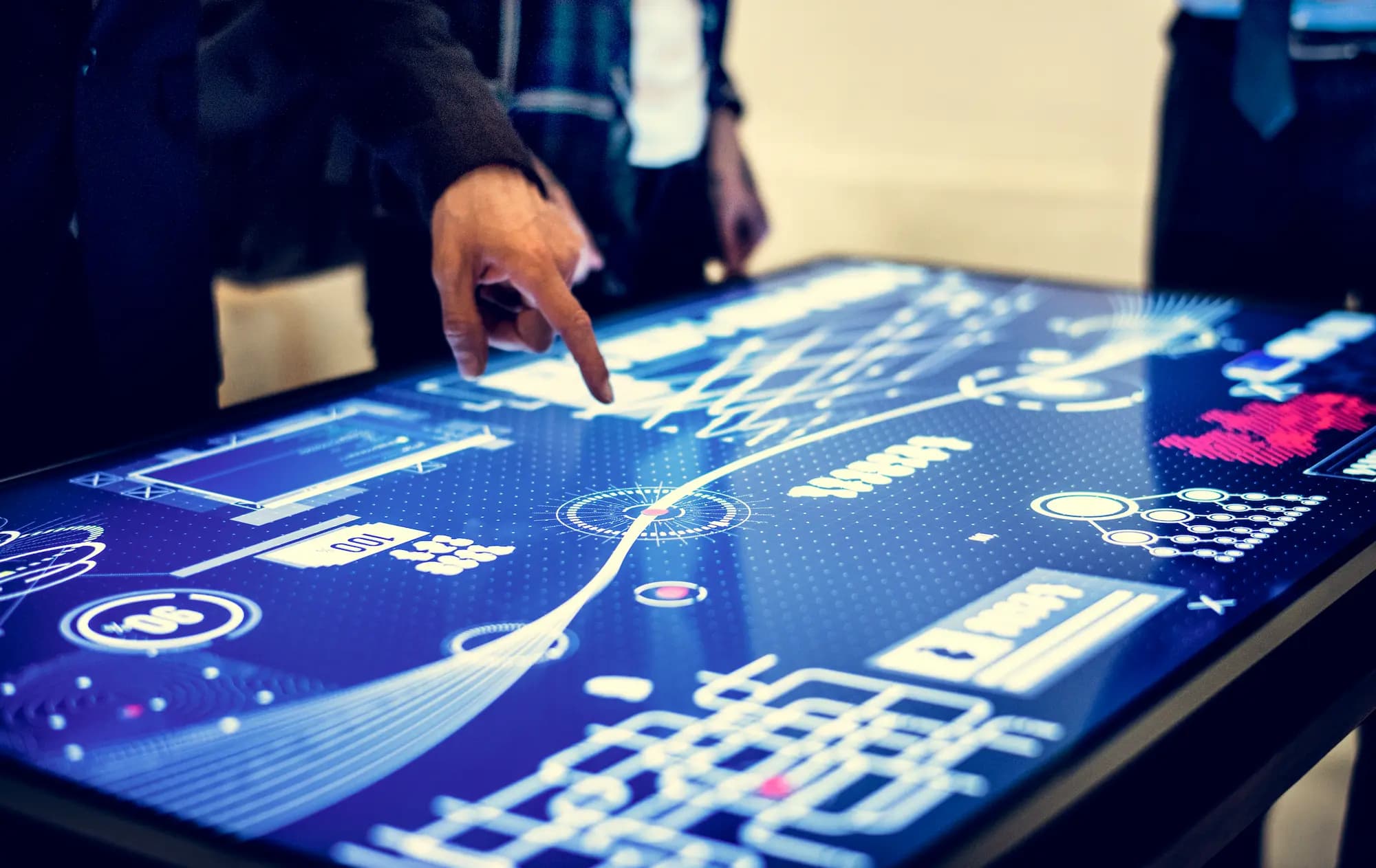 Developer analyzing data and system diagrams on an interactive screen, displaying data visualizations and system diagrams, representing AI-assisted analysis and design in the software development lifecycle.