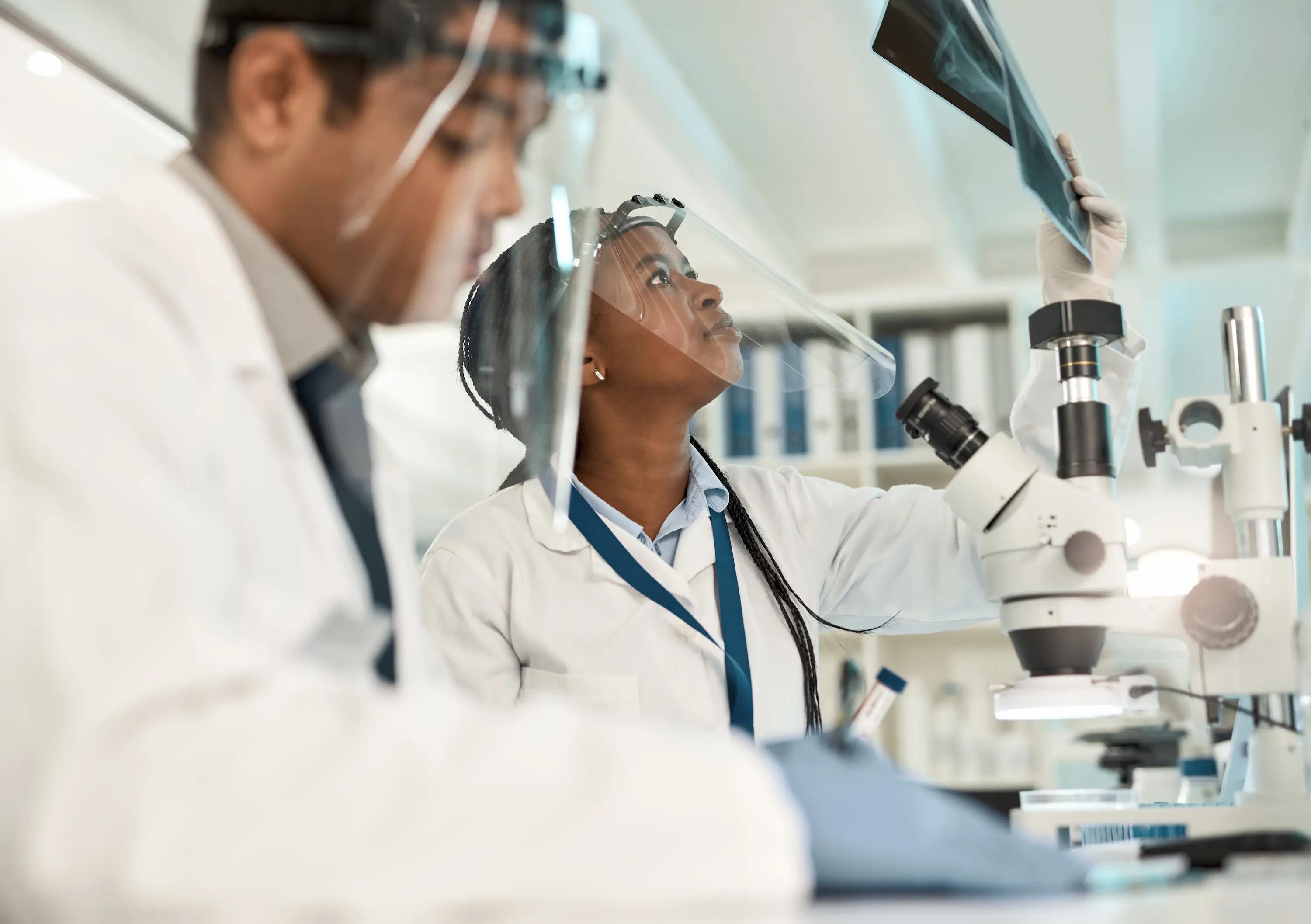 shot-of-a-young-scientist-analysing-x-rays