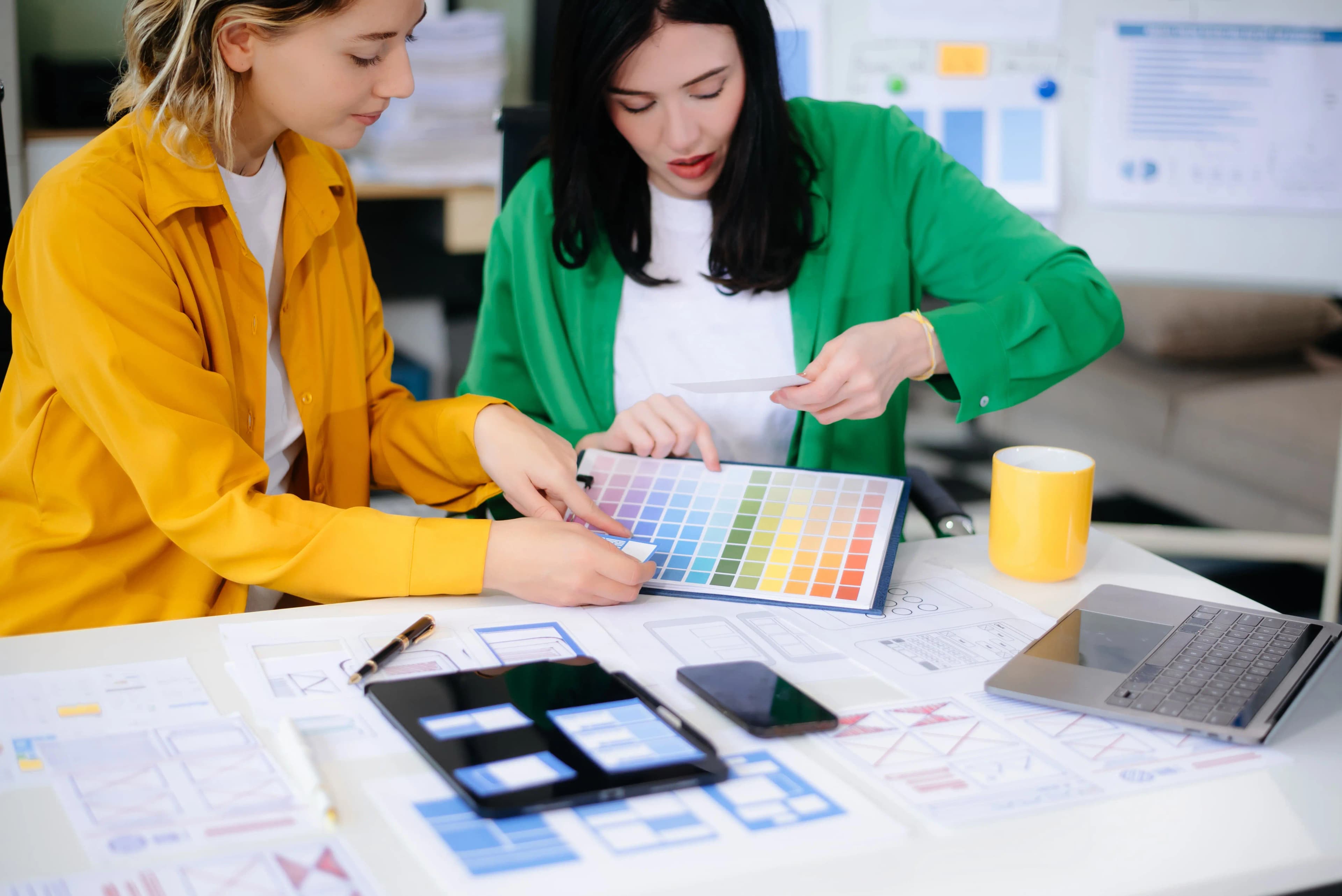 UX designers working on a color palette for mobile apps