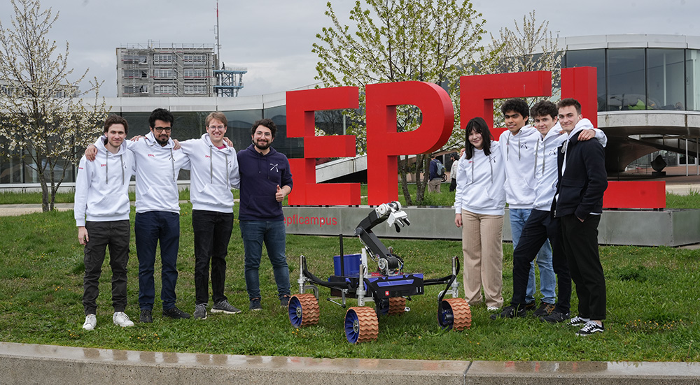 people in front of EPFL logo