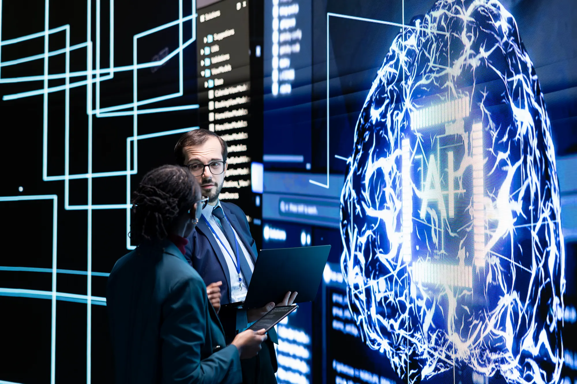 Technology experts analyzing an artificial intelligence brain interface displaying neural networks and data analytics.